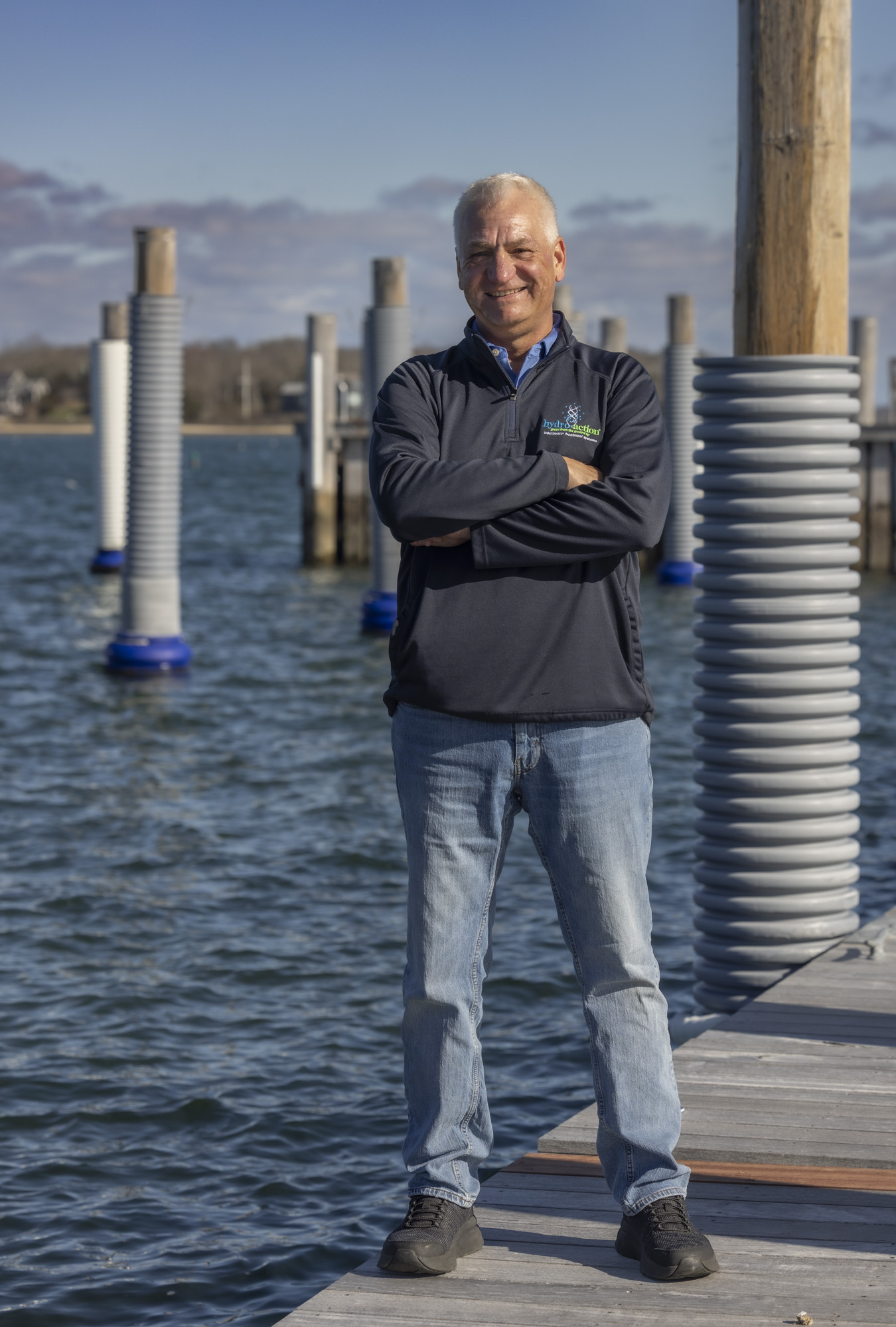 Wastewater Works team member standing by the water
