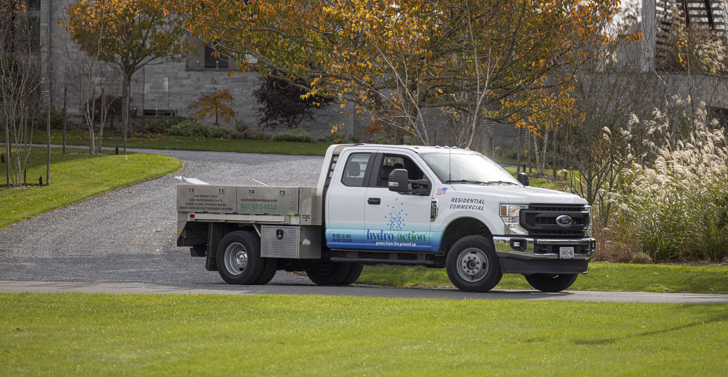 Wastewater Works truck parked at a home